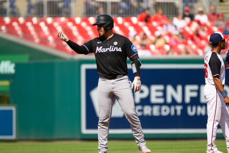 Sep 15, 2024; Washington, District of Columbia, USA; Miami Marlins catcher Jhonny Pereda (89) gestures towards the dugout after hitting a double against the Washington Nationals during the third inning at Nationals Park. Mandatory Credit: Rafael Suanes-Imagn Images