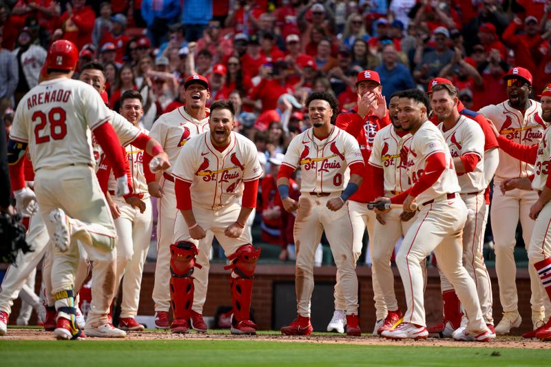 Apr 26, 2025; St. Louis, Missouri, USA;  St. Louis Cardinals third baseman Nolan Arenado (28) is mobbed by teammates after hitting a solo walk-off home run against the Milwaukee Brewers during the ninth inning at Busch Stadium. Mandatory Credit: Jeff Curry-Imagn Images