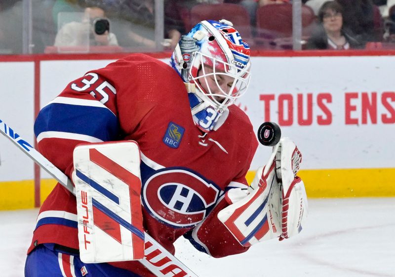 Apr 2, 2024; Montreal, Quebec, CAN; Montreal Canadiens goalie Sam Montembeault (35) makes a save during the third period of the game against the Florida Panthers at the Bell Centre. Mandatory Credit: Eric Bolte-USA TODAY Sports