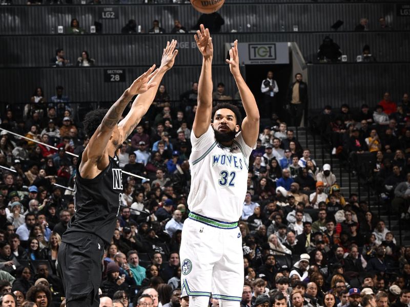 BROOKLYN, NY - JANUARY 25: Karl-Anthony Towns #32 of the Minnesota Timberwolves shoots a three point basket against the Brooklyn Nets on January 25, 2024 at Barclays Center in Brooklyn, New York. NOTE TO USER: User expressly acknowledges and agrees that, by downloading and or using this Photograph, user is consenting to the terms and conditions of the Getty Images License Agreement. Mandatory Copyright Notice: Copyright 2024 NBAE (Photo by David Dow/NBAE via Getty Images)