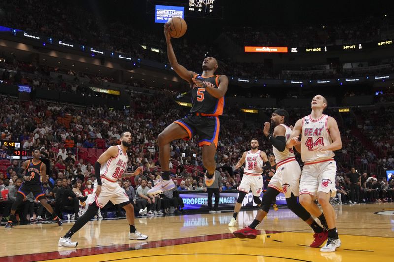 MIAMI, FLORIDA - MARCH 03: Immanuel Quickley #5 of the New York Knicks attempts a layup during the first half against the Miami Heat at Miami-Dade Arena on March 03, 2023 in Miami, Florida. NOTE TO USER: User expressly acknowledges and agrees that,?by downloading and or using this photograph,? User is consenting to the terms and conditions of the Getty Images License Agreement. (Photo by Eric Espada/Getty Images)