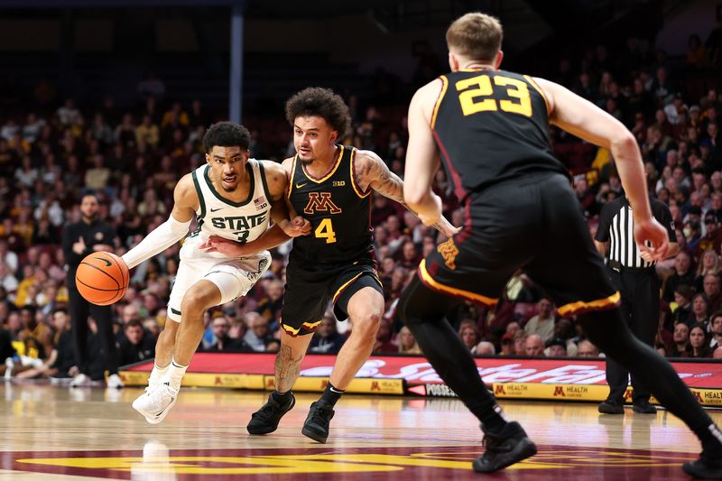 Feb 6, 2024; Minneapolis, Minnesota, USA; Michigan State Spartans guard Jaden Akins (3) works around Minnesota Golden Gophers guard Braeden Carrington (4) during the second half at Williams Arena. Mandatory Credit: Matt Krohn-USA TODAY Sports