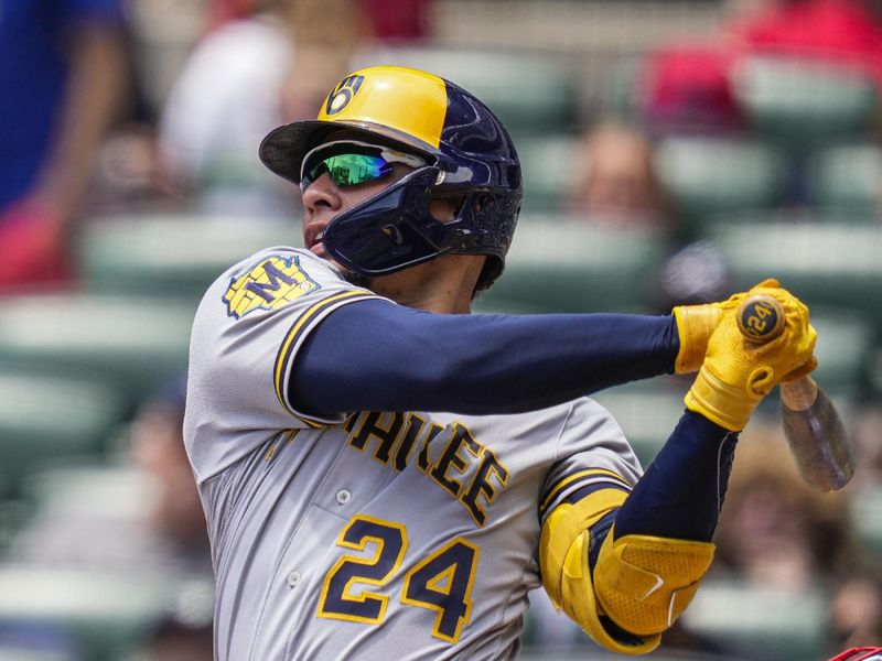 Jul 30, 2023; Cumberland, Georgia, USA; Milwaukee Brewers catcher William Contreras (24) singles against the Atlanta Braves during the first inning at Truist Park. Mandatory Credit: Dale Zanine-USA TODAY Sports