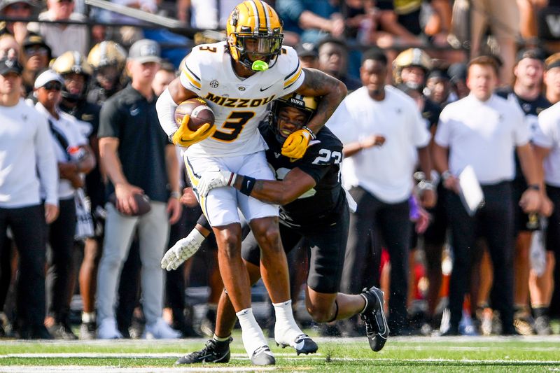 Sep 30, 2023; Nashville, Tennessee, USA;  Vanderbilt Commodores defensive back Jaylen Mahoney (23) tackles Missouri Tigers wide receiver Luther Burden III (3) for a loss during the first half at FirstBank Stadium. Mandatory Credit: Steve Roberts-USA TODAY Sports