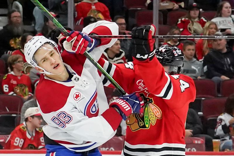 Oct 11, 2025; Chicago, Illinois, USA; Chicago Blackhawks defenseman Wyatt Kaiser (44) checks Montréal Canadiens right wing Ivan Demidov (93) during the second period at United Center. Mandatory Credit: David Banks-Imagn Images