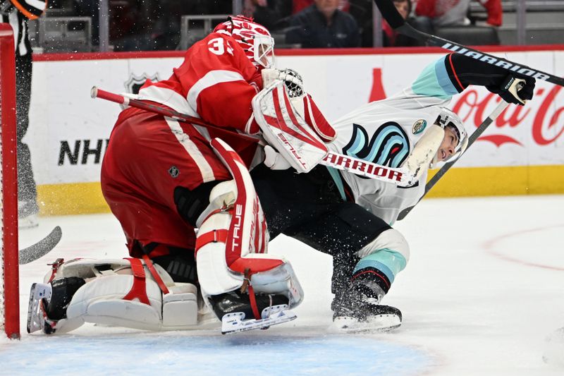 Oct 24, 2023; Detroit, Michigan, USA; Seattle Kraken center Yanni Gourde (37) loses his balance and slides into Detroit Red Wings goaltender Ville Husso (35) in the third period at Little Caesars Arena. Mandatory Credit: Lon Horwedel-USA TODAY Sports