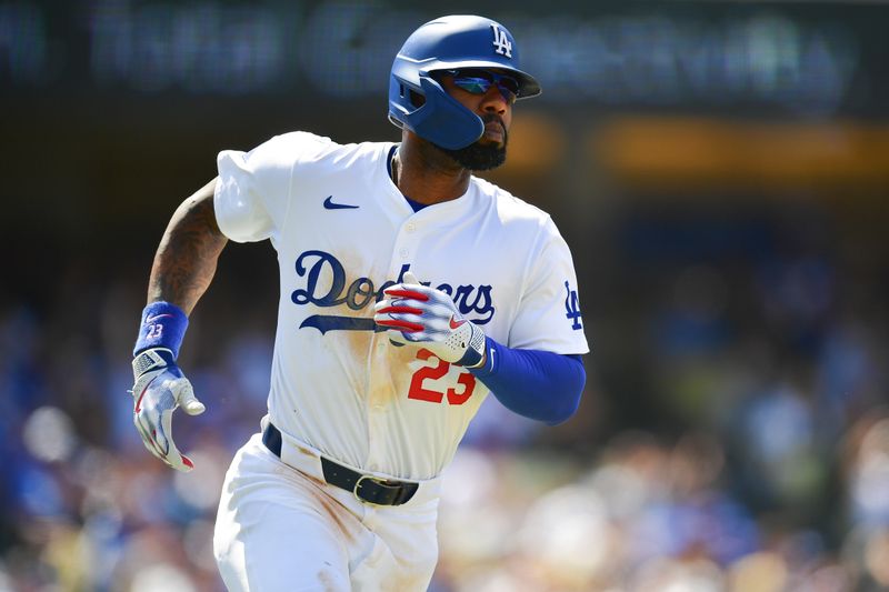 May 19, 2024; Los Angeles, California, USA; Los Angeles Dodgers right fielder Jason Heyward (23) runs after hitting a single against the Cincinnati Reds during the seventh inning at Dodger Stadium. Mandatory Credit: Gary A. Vasquez-USA TODAY Sports