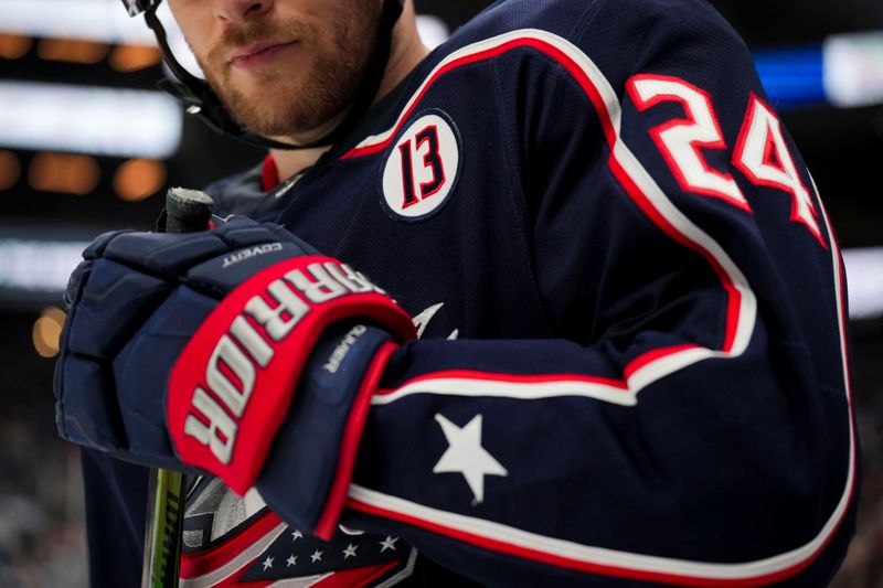 Oct 22, 2024; Columbus, Ohio, USA; Oct 22, 2024; Columbus, Ohio, USA; A patch honoring the late Johnny Gaudreau is seen on the jersey worn by Columbus Blue Jackets right wing Mathieu Olivier (24) during a stop in play against the Toronto Maple Leafs in the second period at Nationwide Arena. Mandatory Credit: Aaron Doster-Imagn Images