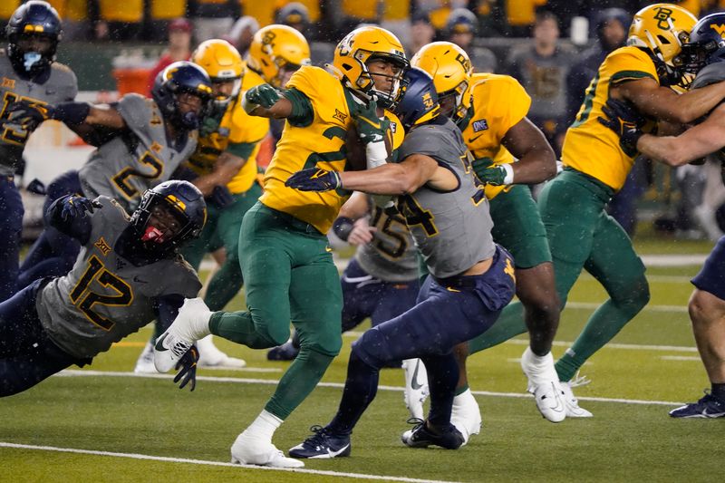 Nov 25, 2023; Waco, Texas, USA; Baylor Bears kick returner Richard Reese (29) runs past West Virginia Mountaineers safety Anthony Wilson (12) and fullback Luke Hamilton (34) on a 96-yard kick off return during the first half at McLane Stadium. Mandatory Credit: Raymond Carlin III-USA TODAY Sports