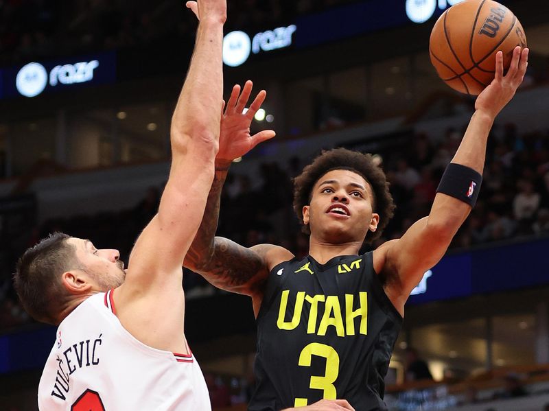 CHICAGO, ILLINOIS - NOVEMBER 06: Keyonte George #3 of the Utah Jazz goes up for a layup against Nikola Vucevic #9 of the Chicago Bulls during the second half at the United Center on November 06, 2023 in Chicago, Illinois. NOTE TO USER: User expressly acknowledges and agrees that, by downloading and or using this photograph, User is consenting to the terms and conditions of the Getty Images License Agreement. (Photo by Michael Reaves/Getty Images)