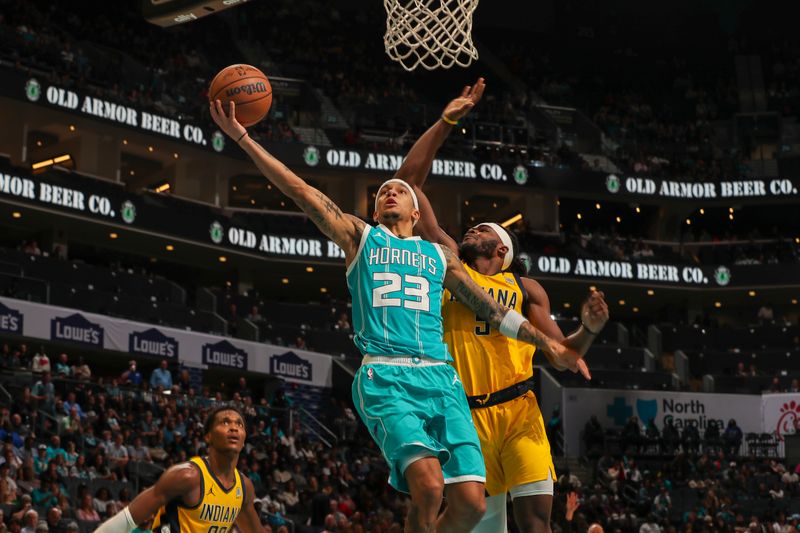 CHARLOTTE, NC - NOVEMBER 8:  Tre Mann #23 of the Charlotte Hornets shoots the ball during the game against the Indiana Pacers on November 8, 2024 at Spectrum Center in Charlotte, North Carolina. NOTE TO USER: User expressly acknowledges and agrees that, by downloading and or using this photograph, User is consenting to the terms and conditions of the Getty Images License Agreement. Mandatory Copyright Notice: Copyright 2024 NBAE (Photo by Kent Smith/NBAE via Getty Images)