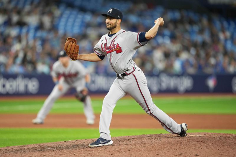 May 12, 2023; Toronto, Ontario, CAN; Atlanta Braves relief pitcher Danny Young (65) throws a pitch against the Toronto Blue Jays during the seventh inning at Rogers Centre. Mandatory Credit: Nick Turchiaro-USA TODAY Sports