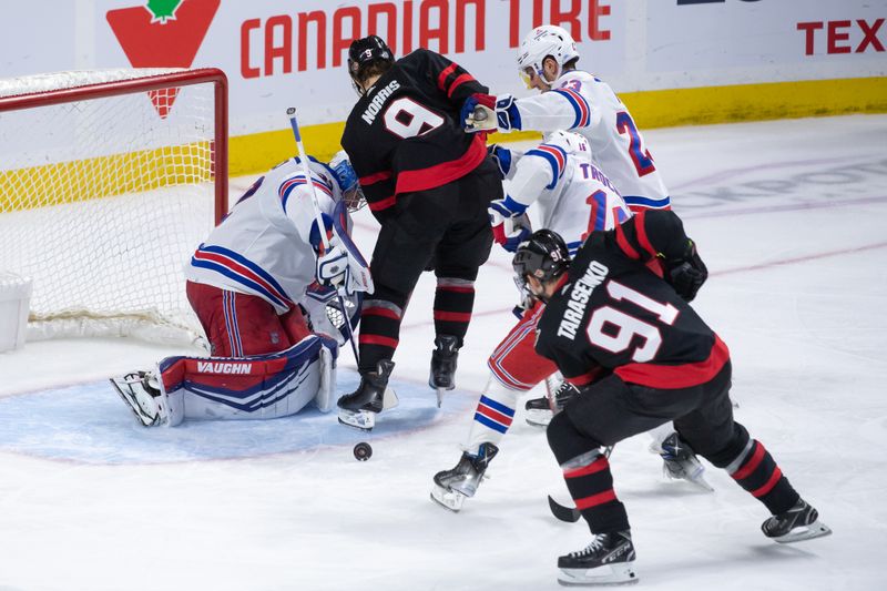 Jan 27, 2024; Ottawa, Ontario, CAN; New York Rangers goalie Jonathan Quick (32) makes a save in front of Ottawa Senators center Josh Norris (9) in the third period at the Canadian Tire Centre. Mandatory Credit: Marc DesRosiers-USA TODAY Sports