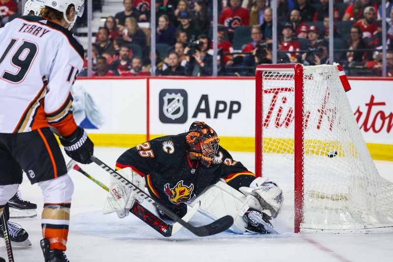 Apr 2, 2024; Calgary, Alberta, CAN; Anaheim Ducks right wing Troy Terry (19) scores a goal against Calgary Flames goaltender Jacob Markstrom (25) during the second period at Scotiabank Saddledome. Mandatory Credit: Sergei Belski-USA TODAY Sports