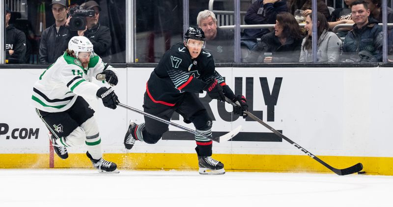 Nov 26, 2025; Seattle, Washington, USA; Seattle Kraken forward Jaden Schwartz (17) skates against Dallas Stars forward Sam Steel (18) during the second period at Climate Pledge Arena. Mandatory Credit: Stephen Brashear-Imagn Images