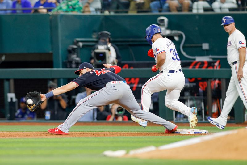 May 1, 2024; Arlington, Texas, USA; Texas Rangers outfielder Wyatt Langford (36) beats out a throw to Washington Nationals first base Joey Meneses (45) during the fourth inning at Globe Life Field. Mandatory Credit: Andrew Dieb-USA TODAY Sports