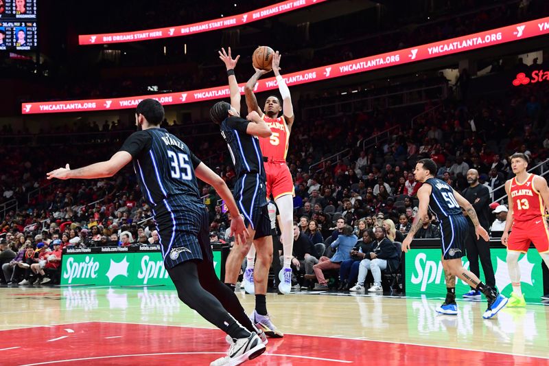 ATLANTA, GA - FEBRUARY 25: Dejounte Murray #5 of the Atlanta Hawks shoots the ball during the game against the Orlando Magic on February 25, 2024 at State Farm Arena in Atlanta, Georgia.  NOTE TO USER: User expressly acknowledges and agrees that, by downloading and/or using this Photograph, user is consenting to the terms and conditions of the Getty Images License Agreement. Mandatory Copyright Notice: Copyright 2024 NBAE (Photo by Scott Cunningham/NBAE via Getty Images)