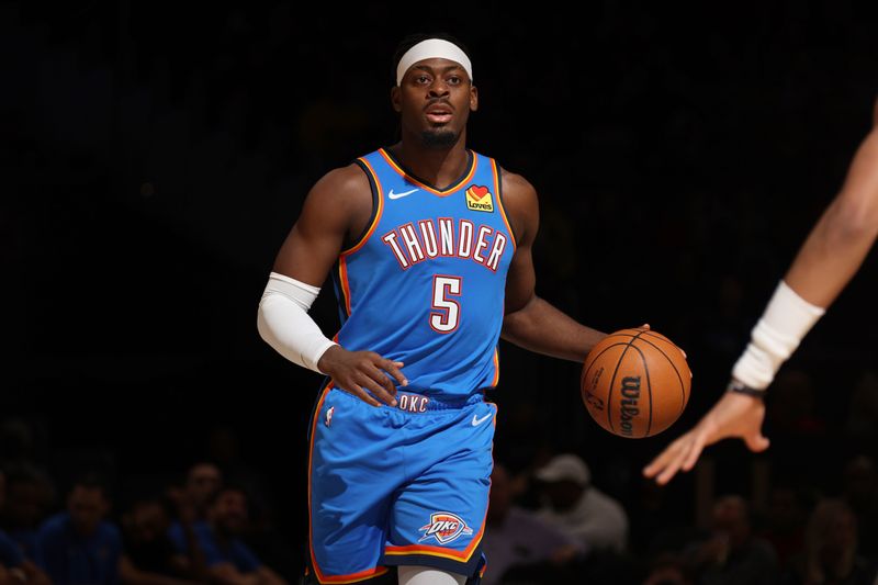 WASHINGTON, DC -? JANUARY 8: Luguentz Dort #5 of the Oklahoma City Thunder dribbles the ball during the game against the Washington Wizards on January 8, 2024 at Capital One Arena in Washington, DC. NOTE TO USER: User expressly acknowledges and agrees that, by downloading and or using this Photograph, user is consenting to the terms and conditions of the Getty Images License Agreement. Mandatory Copyright Notice: Copyright 2024 NBAE (Photo by Stephen Gosling/NBAE via Getty Images)