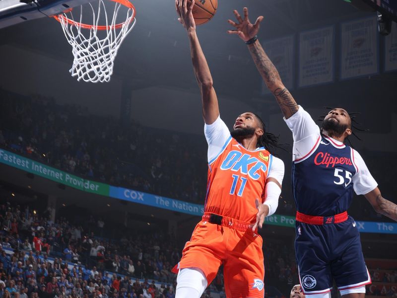 OKLAHOMA CITY, OK - NOVEMBER 11: Isaiah Joe #11 of the Oklahoma City Thunder drives to the basket during the game against the LA Clippers on November 11, 2024 at Paycom Center in Oklahoma City, Oklahoma. NOTE TO USER: User expressly acknowledges and agrees that, by downloading and or using this photograph, User is consenting to the terms and conditions of the Getty Images License Agreement. Mandatory Copyright Notice: Copyright 2024 NBAE (Photo by Nathaniel S. Butler/NBAE via Getty Images)