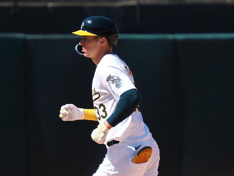 May 23, 2024; Oakland, California, USA; Oakland Athletics center fielder JJ Bleday (33) rounds the bases on a two-run home run against the Colorado Rockies during the eleventh inning at Oakland-Alameda County Coliseum. Mandatory Credit: Kelley L Cox-USA TODAY Sports