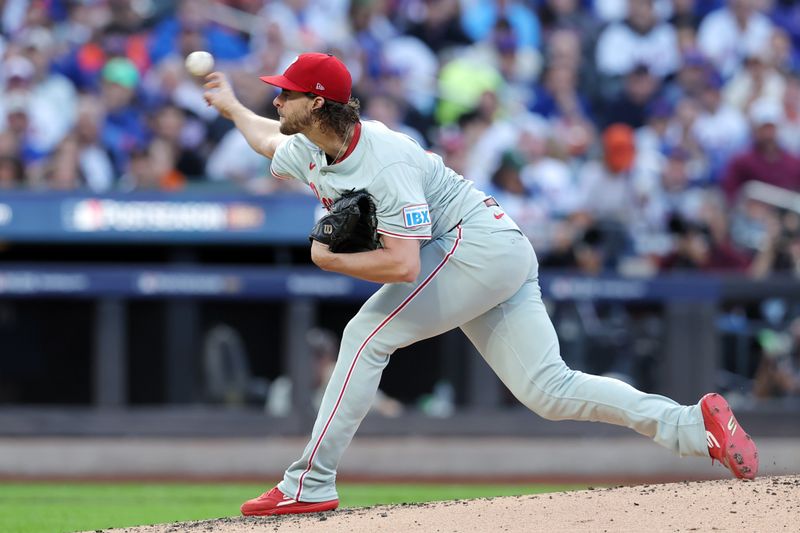 Oct 8, 2024; New York City, New York, USA; Philadelphia Phillies pitcher Aaron Nola (27) pitches against the New York Mets in the first inning during game three of the NLDS for the 2024 MLB Playoffs at Citi Field. Mandatory Credit: Brad Penner-Imagn Images