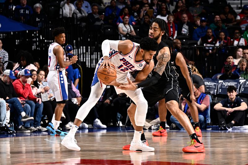 PHILADELPHIA, PA - APRIL 14:  Tobias Harris #12 of the Philadelphia 76ers handles the ball during the game against the Brooklyn Nets on April 14, 2024 at the Wells Fargo Center in Philadelphia, Pennsylvania NOTE TO USER: User expressly acknowledges and agrees that, by downloading and/or using this Photograph, user is consenting to the terms and conditions of the Getty Images License Agreement. Mandatory Copyright Notice: Copyright 2024 NBAE (Photo by David Dow/NBAE via Getty Images)