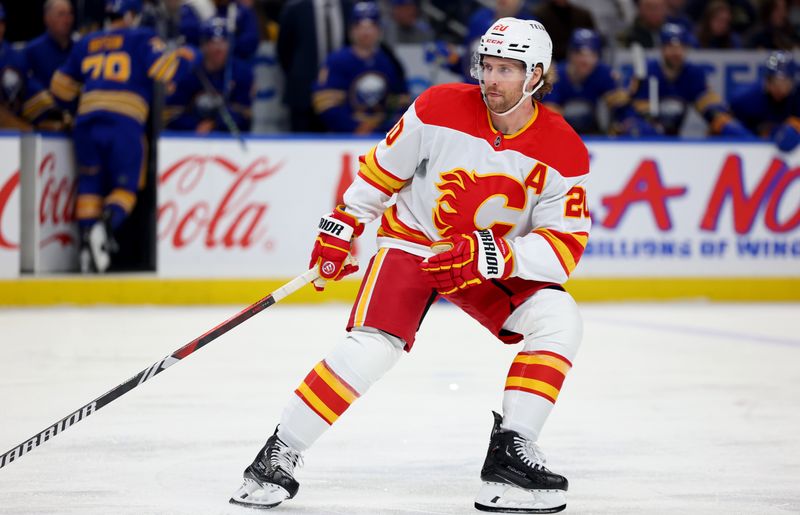 Nov 9, 2024; Buffalo, New York, USA;  Calgary Flames center Blake Coleman (20) looks for the puck during the first period against the Buffalo Sabres at KeyBank Center. Mandatory Credit: Timothy T. Ludwig-Imagn Images