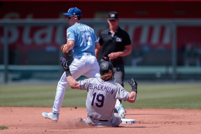 Jun 3, 2023; Kansas City, Missouri, USA; Colorado Rockies designated hitter Charlie Blackmon (19) slides into second base during the first inning against the Kansas City Royals at Kauffman Stadium. Mandatory Credit: William Purnell-USA TODAY Sports