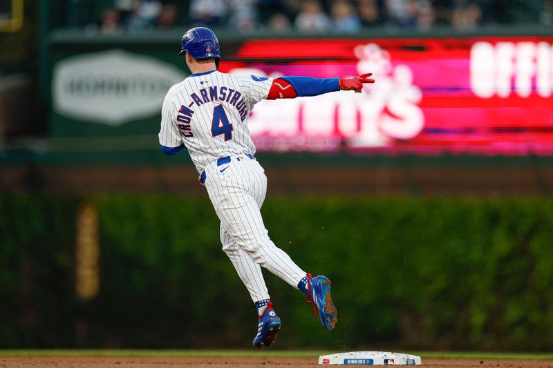 May 13, 2025; Chicago, Illinois, USA; Chicago Cubs center fielder Pete Crow-Armstrong (4) rounds the bases after hitting a solo home run against the Miami Marlins during the third inning at Wrigley Field. Mandatory Credit: Kamil Krzaczynski-Imagn Images