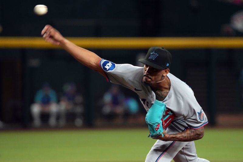 Jun 27, 2025; Phoenix, Arizona, USA; Miami Marlins pitcher Ronny Henriquez (32) throws against the Arizona Diamondbacks in the fifth inning at Chase Field. Mandatory Credit: Rick Scuteri-Imagn Images