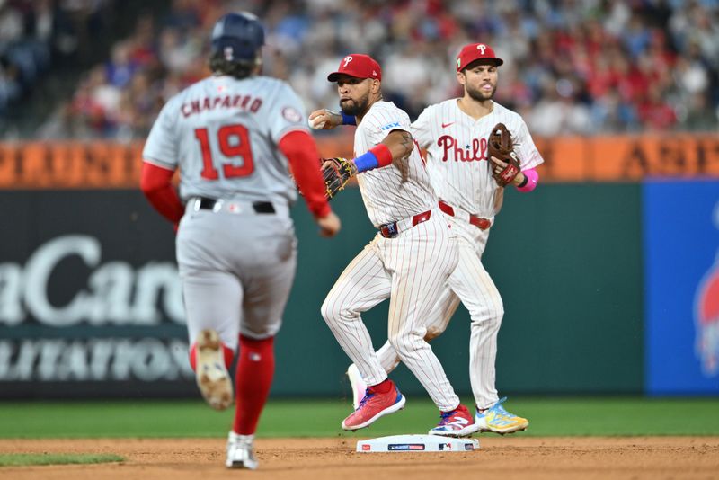 Aug 17, 2024; Philadelphia, Pennsylvania, USA; Philadelphia Phillies infielder Edmundo Sosa (33) turns a double play against the Washington Nationals in the eighth inning at Citizens Bank Park. Mandatory Credit: Kyle Ross-USA TODAY Sports