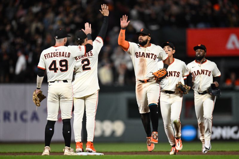 Jun 4, 2025; San Francisco, California, USA; San Francisco Giants left fielder Heliot Ramos (17) celebrates with shortstop Willy Adames (2) and second baseman Tyler Fitzgerald (49) after their win over the San Diego Padres at Oracle Park. Mandatory Credit: Eakin Howard-Imagn Images