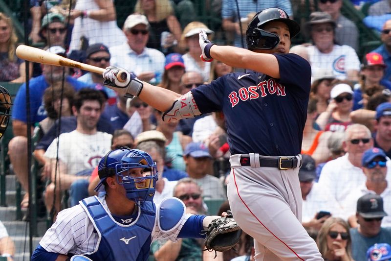 Jul 16, 2023; Chicago, Illinois, USA; Boston Red Sox left fielder Masataka Yoshida (7) hits a grand slam home run against the Chicago Cubs during the fifth inning at Wrigley Field. Mandatory Credit: David Banks-USA TODAY Sports