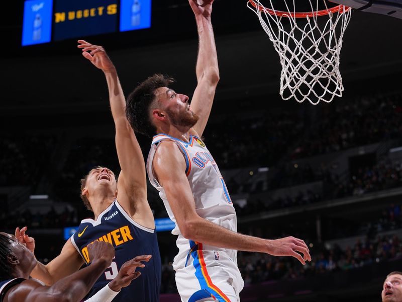DENVER, CO - NOVEMBER 6: Chet Holmgren #7 of the Oklahoma City Thunder dunks the ball during the game against the Denver Nuggets  during a regular season game on November 6, 2024 at Ball Arena in Denver, Colorado. NOTE TO USER: User expressly acknowledges and agrees that, by downloading and/or using this Photograph, user is consenting to the terms and conditions of the Getty Images License Agreement. Mandatory Copyright Notice: Copyright 2024 NBAE (Photo by Bart Young/NBAE via Getty Images)