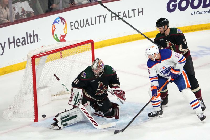 Feb 19, 2024; Tempe, Arizona, USA; Arizona Coyotes goalie Matt Villalta (31) makes a save onEdmonton Oilers left wing Zach Hyman (18) during the first period at Mullett Arena. Mandatory Credit: Joe Camporeale-USA TODAY Sports