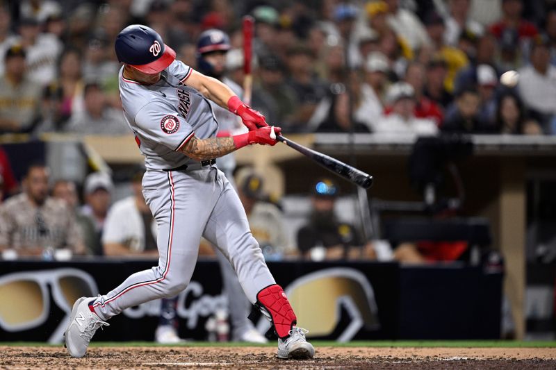 Jun 24, 2024; San Diego, California, USA; Washington Nationals third baseman Nick Senzel (13) hits a two-run home run against the San Diego Padres during the tenth inning at Petco Park. Mandatory Credit: Orlando Ramirez-USA TODAY Sports