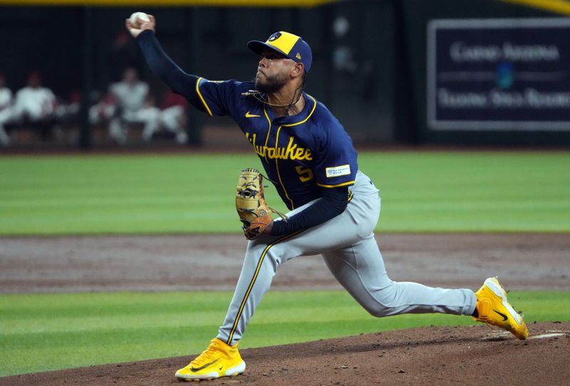 Sep 13, 2024; Phoenix, Arizona, USA; Milwaukee Brewers pitcher Freddy Peralta (51) pithces against the Arizona Diamondbacks during the first inning at Chase Field. Mandatory Credit: Joe Camporeale-Imagn Images