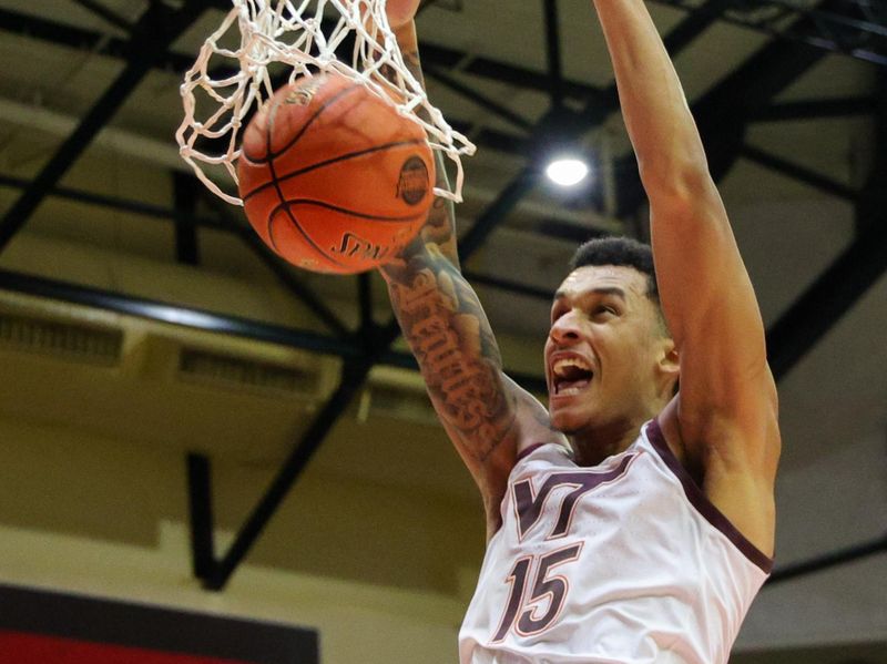 Nov 23, 2023; Kissimmee, FL, USA;  Virginia Tech Hokies center Lynn Kidd (15) dunks the ball against the Boise State Broncos in the second half during the ESPN Events Invitational at State Farm Field House. Mandatory Credit: Nathan Ray Seebeck-USA TODAY Sports