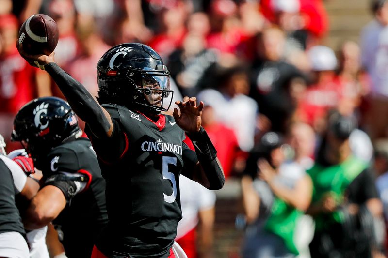 Sep 23, 2023; Cincinnati, Ohio, USA; Cincinnati Bearcats quarterback Emory Jones (5) throws a pass against the Oklahoma Sooners in the second half at Nippert Stadium. Mandatory Credit: Katie Stratman-USA TODAY Sports