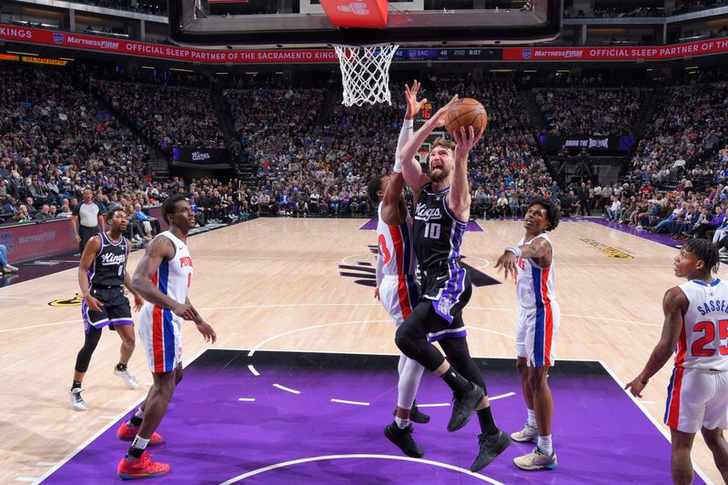 SACRAMENTO, CA - FEBRUARY 7: Domantas Sabonis #10 of the Sacramento Kings drives to the basket during the game against the Detroit Pistons on February 7, 2024 at Golden 1 Center in Sacramento, California. NOTE TO USER: User expressly acknowledges and agrees that, by downloading and or using this Photograph, user is consenting to the terms and conditions of the Getty Images License Agreement. Mandatory Copyright Notice: Copyright 2024 NBAE (Photo by Rocky Widner/NBAE via Getty Images)