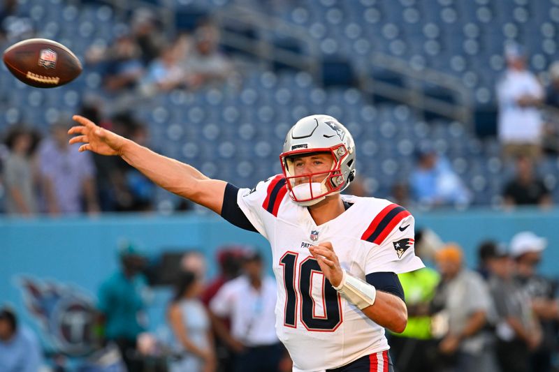 New England Patriots quarterback Mac Jones (10) warms up in the first half of an NFL preseason football game against the Tennessee Titans Friday, Aug. 25, 2023, in Nashville, Tenn. (AP Photo/John Amis)