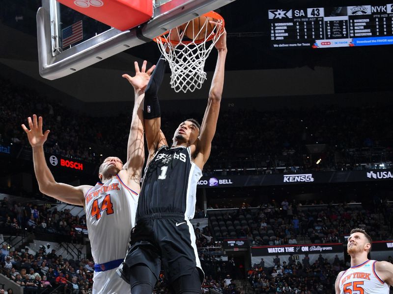 SAN ANTONIO, TX - MARCH 29: Victor Wembanyama #1 of the San Antonio Spurs dunks the ball during the game against the New York Knicks on March 29, 2024 at the Frost Bank Center in San Antonio, Texas. NOTE TO USER: User expressly acknowledges and agrees that, by downloading and or using this photograph, user is consenting to the terms and conditions of the Getty Images License Agreement. Mandatory Copyright Notice: Copyright 2024 NBAE (Photos by Michael Gonzales/NBAE via Getty Images)