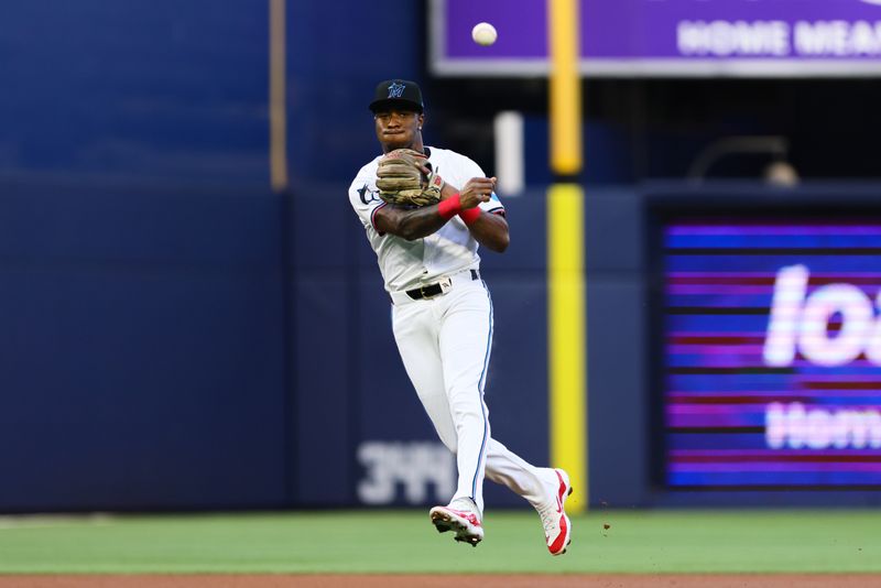 Apr 29, 2024; Miami, Florida, USA; Miami Marlins shortstop Tim Anderson (7) throws to first base to retire Washington Nationals shortstop CJ Abrams (not pictured) during the first inning at loanDepot Park. Mandatory Credit: Sam Navarro-USA TODAY Sports