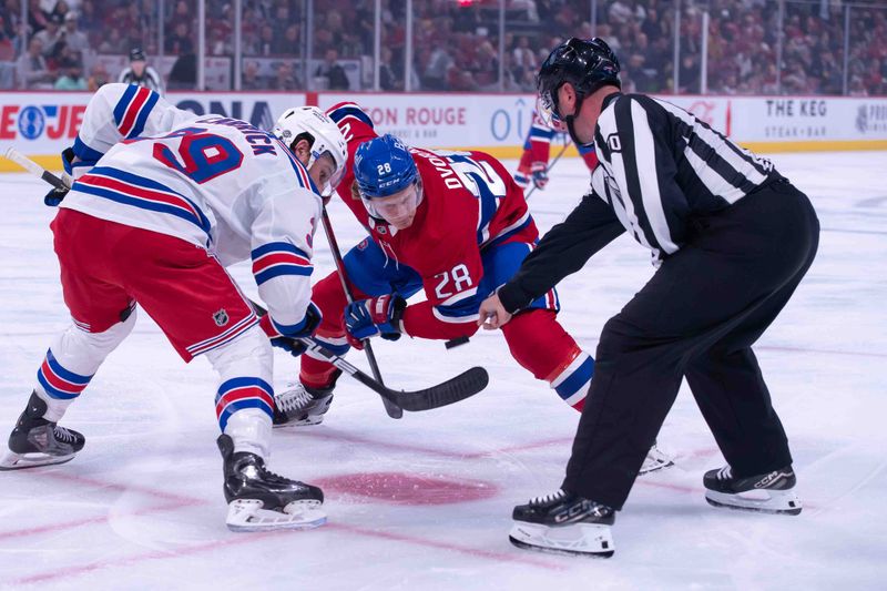 Oct 22, 2024; Ottawa, Ontario, CAN; New York Rangers center Sam Carrick (39) faces off against Montreal Canadiens center Christian Dvorak (28) in the second period at the Bell Centre. Mandatory Credit: Marc DesRosiers-Imagn Images