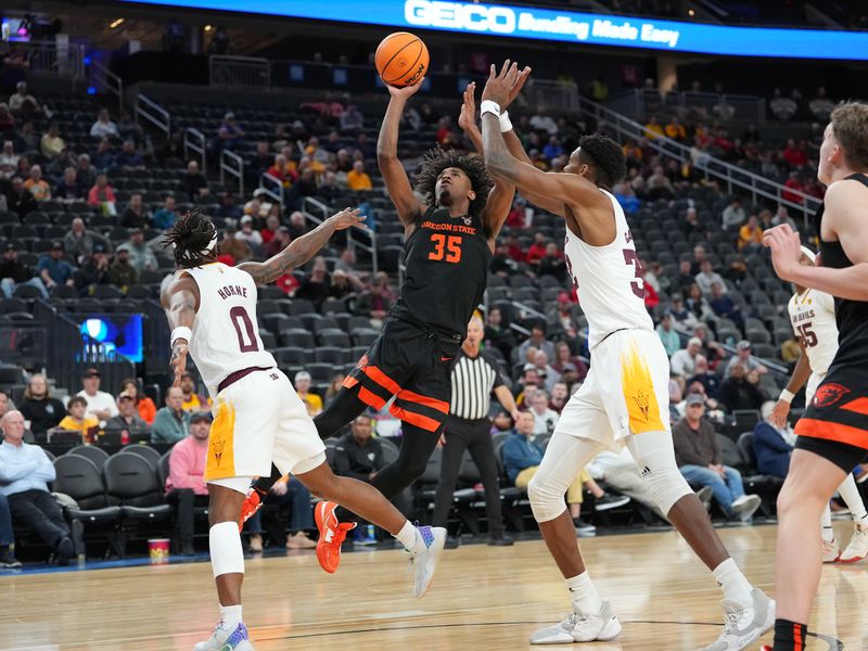 Mar 8, 2023; Las Vegas, NV, USA; Oregon State Beavers forward Glenn Taylor Jr. (35) shoots between Arizona State Sun Devils guard DJ Horne (0) and forward Alonzo Gaffney (32) during the second half at T-Mobile Arena. Mandatory Credit: Stephen R. Sylvanie-USA TODAY Sports