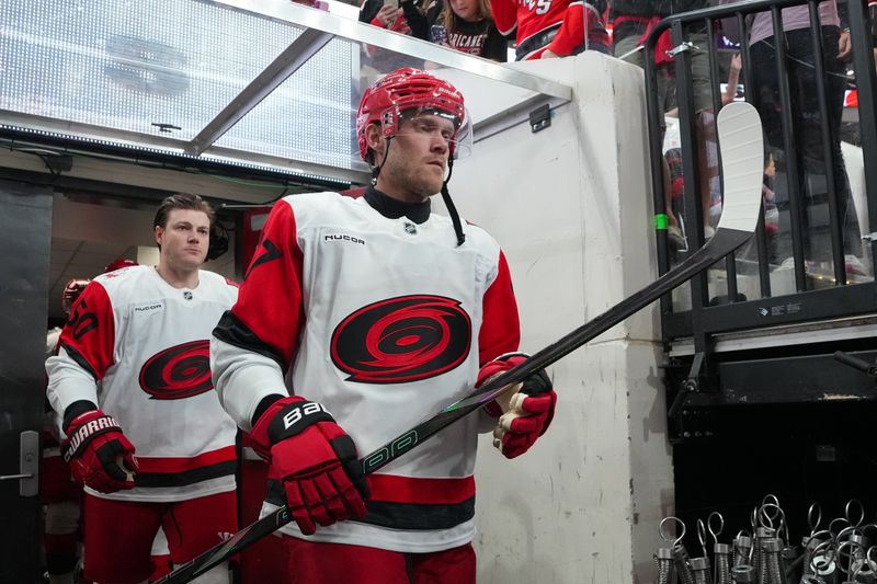 Sep 24, 2025; Raleigh, North Carolina, USA;  Carolina Hurricanes left wing Nikolaj Ehlers (27) comes out of the locker room for the warmups before the game against the Florida Panthers at Lenovo Center. Mandatory Credit: James Guillory-Imagn Images