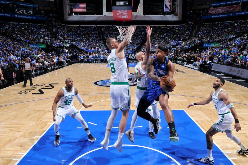 ORLANDO, FL - APRIL 25: Paolo Banchero #5 of the Orlando Magic looks to pass the ball during Round One, Game Three of the 2025 NBA Playoffs against the Boston Celtics on April 25, 2025 at Kia Center in Orlando, Florida. NOTE TO USER: User expressly acknowledges and agrees that, by downloading and or using this photograph, User is consenting to the terms and conditions of the Getty Images License Agreement. Mandatory Copyright Notice: Copyright 2025 NBAE (Photo by Fernando Medina/NBAE via Getty Images)