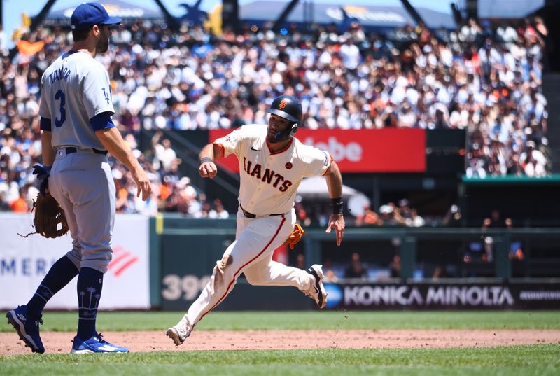 Jun 30, 2024; San Francisco, California, USA; San Francisco Giants first baseman David Villar (32) runs to third base against Los Angeles Dodgers second baseman Gavin Lux (3) during the second inning at Oracle Park. Mandatory Credit: Kelley L Cox-USA TODAY Sports