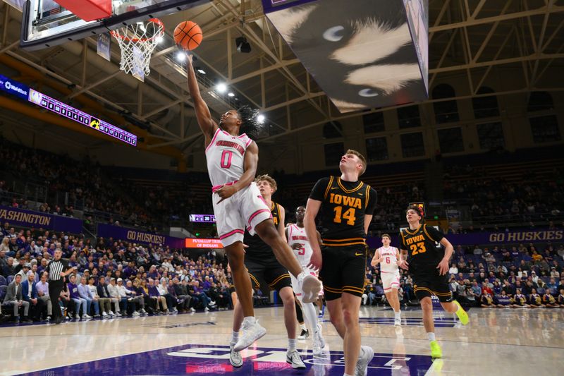Feb 4, 2026; Seattle, Washington, USA; Washington Huskies guard Quimari Peterson (0) shoots a layup against the Iowa Hawkeyes during the first half at Alaska Airlines Arena at Hec Edmundson Pavilion. Mandatory Credit: Steven Bisig-Imagn Images