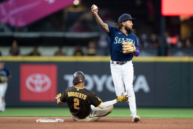 Aug 9, 2023; Seattle, Washington, USA; Seattle Mariners shortstop J.P. Crawford (3) is late on the throw to first after forcing out San Diego Padres shortstop Xander Bogaerts (2) at second base during the sixth inning at T-Mobile Park. Mandatory Credit: Stephen Brashear-USA TODAY Sports